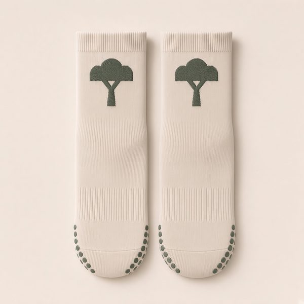 Custom-logo ankle grip socks in Chalk with the live-oak T logo knitted in