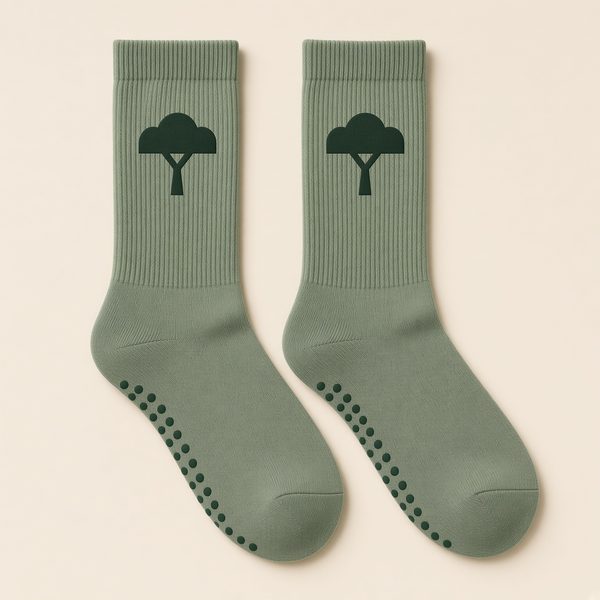 Crew-length grip socks in Sage with the live-oak T logo knitted in